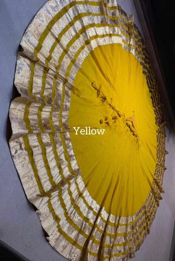 Yellow Pure georgette butti fabric skirt with heavy lampi laces
