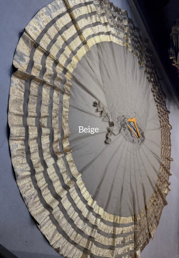 Beige Pure georgette butti fabric skirt with heavy lampi laces