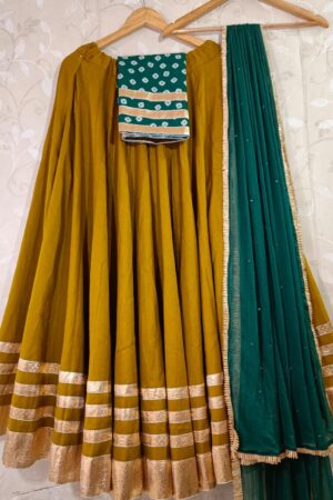 Mustard Yellow Flex Dhabu Lehenga Choli with Bandhej Print Blouse & Teal Sequin Dupatta